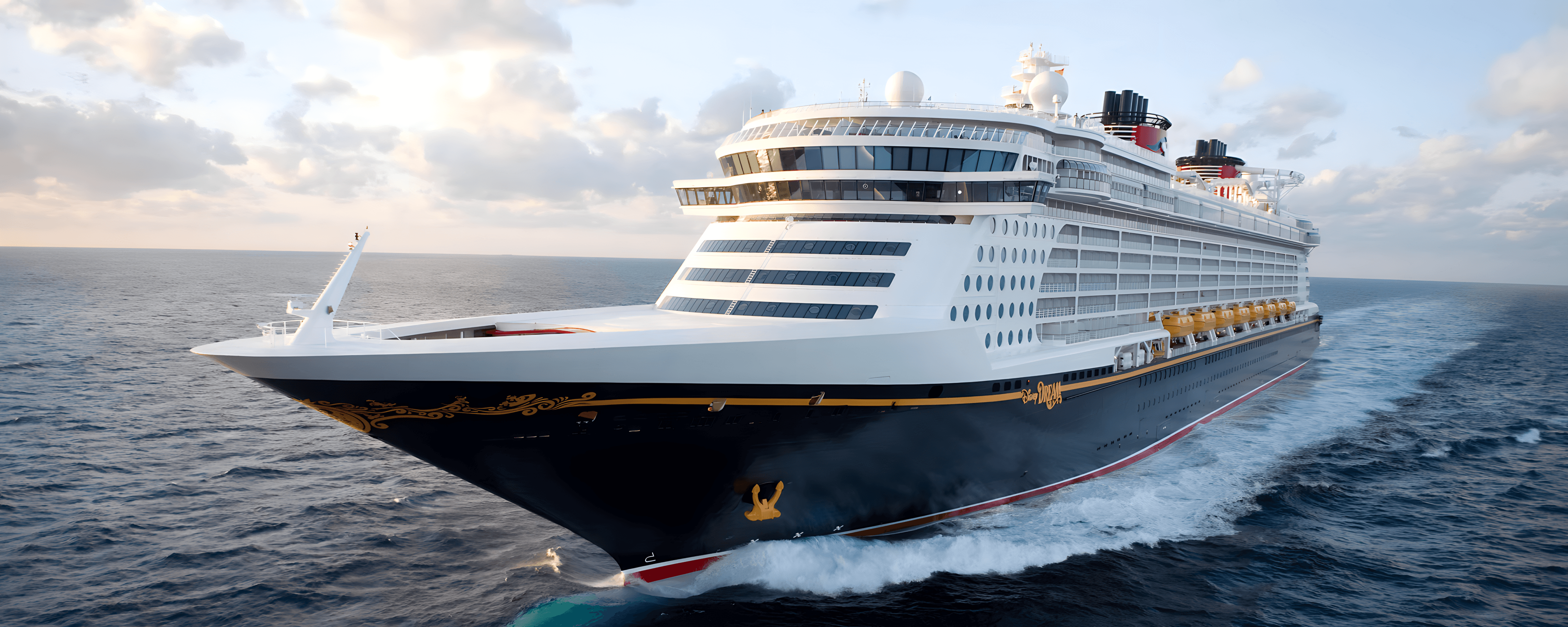Disney Dream cruise ship sailing forward in blue waters