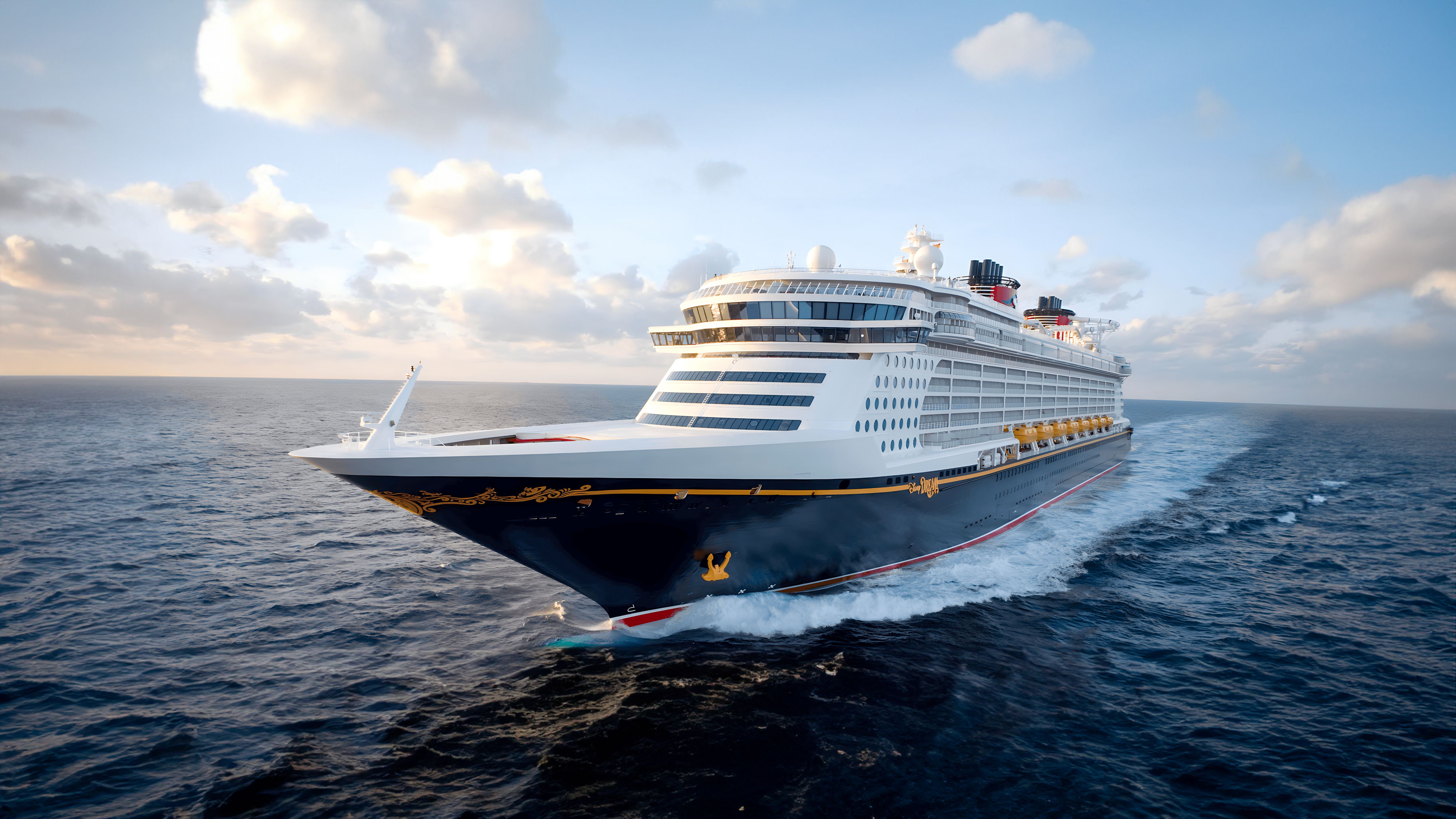 Disney Dream cruise ship sailing forward in blue waters