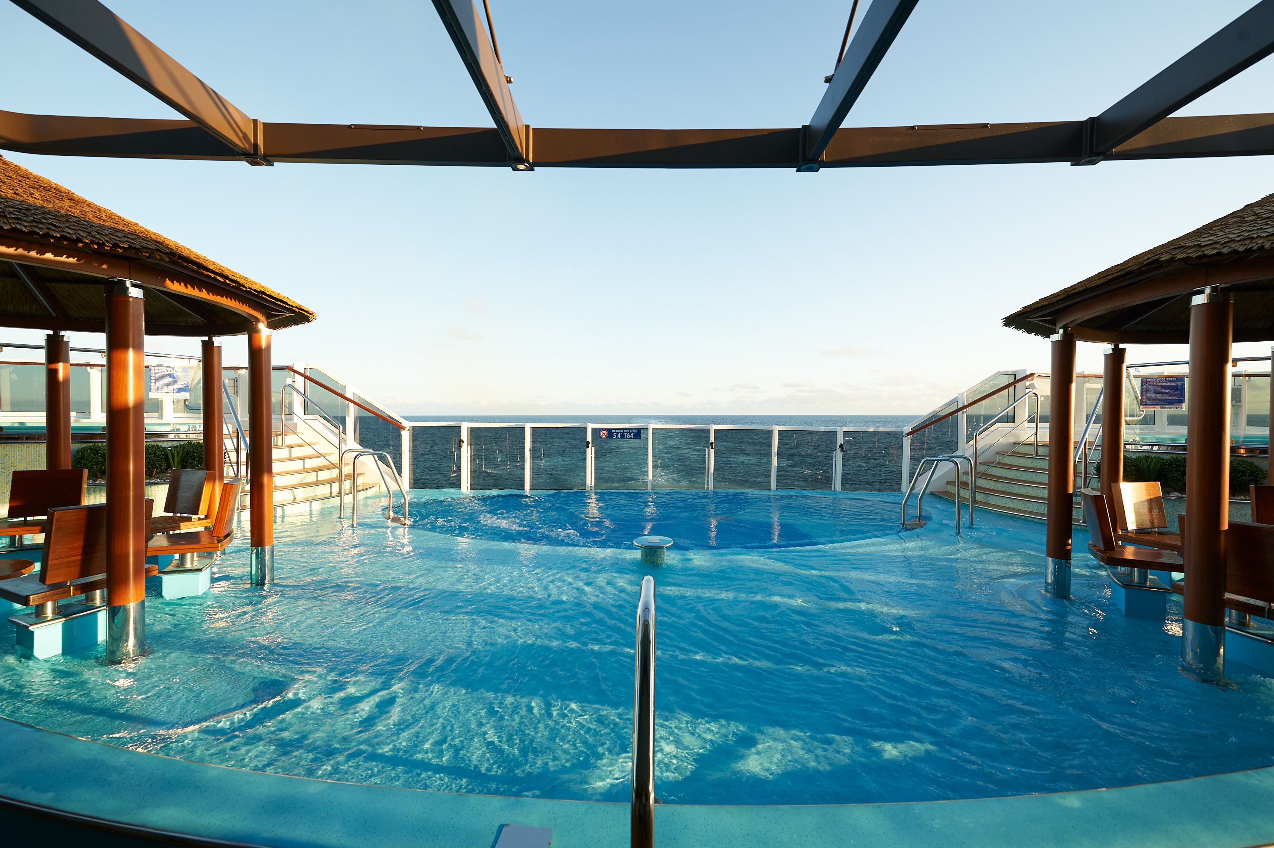 Havana pool on Carnival Panorama offering a tranquil setting with panoramic ocean views and in-water seating.