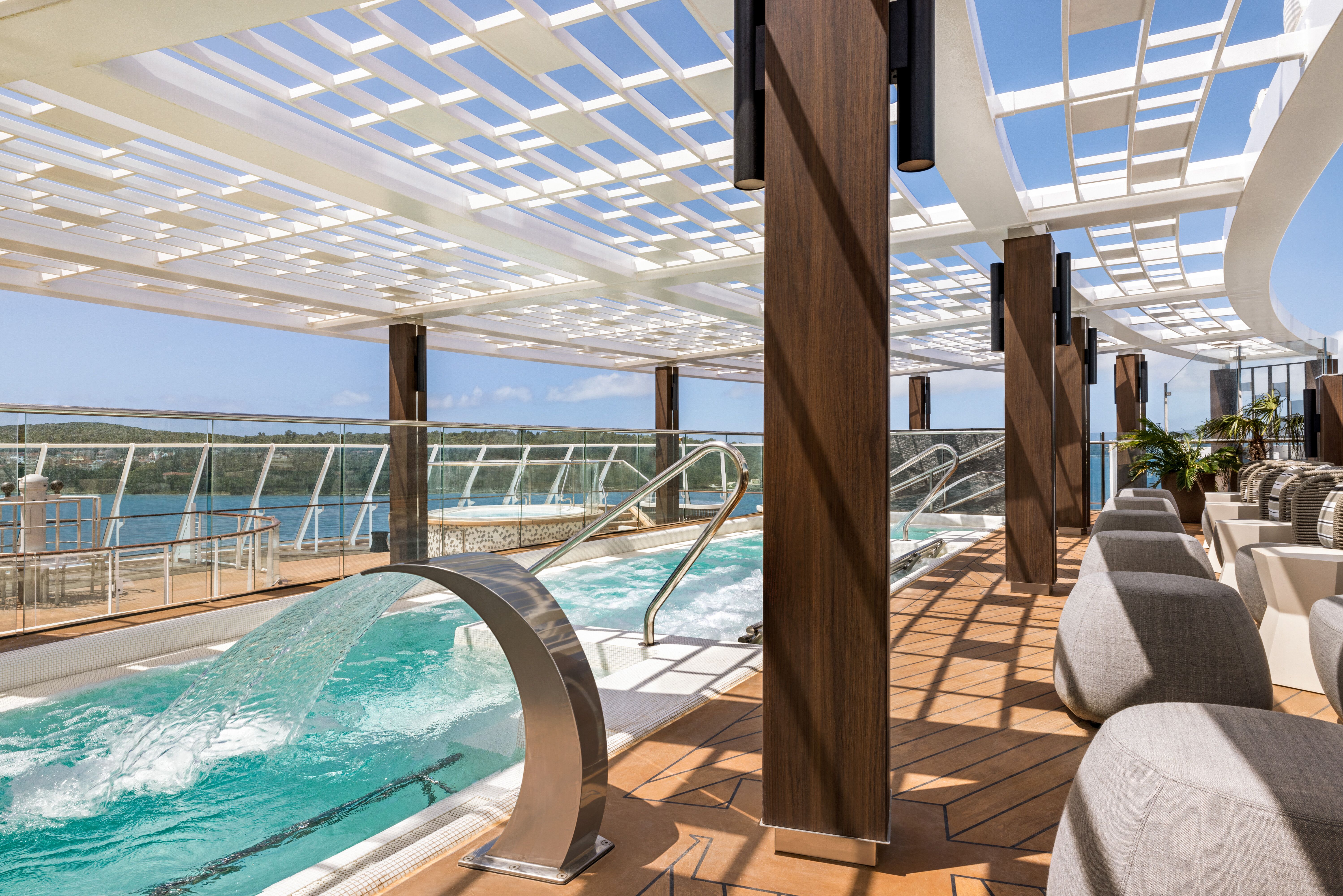 Aquamar Spa on Vista, Oceania Cruises, a serene spa retreat with a thalassotherapy pool and ocean views.