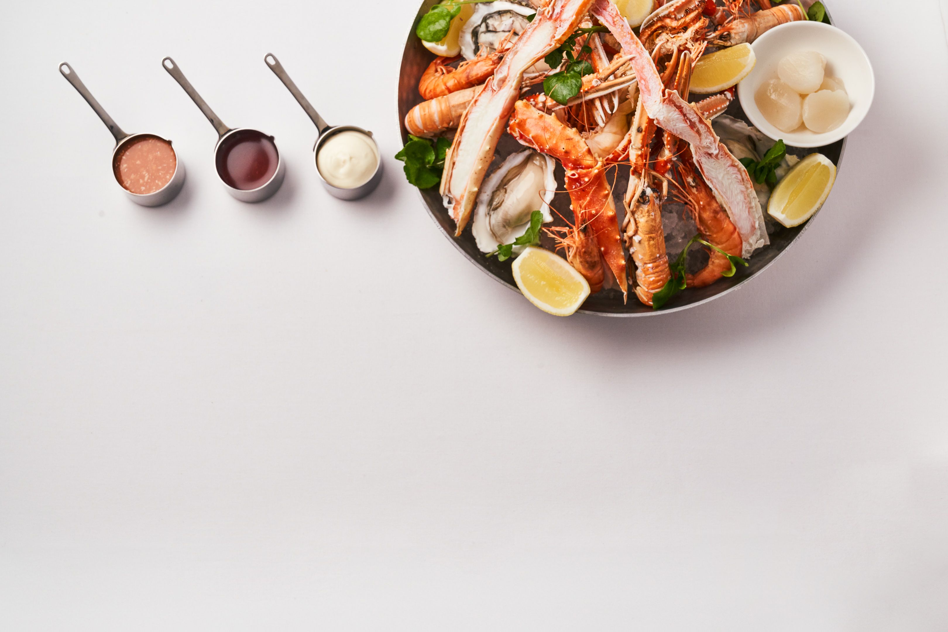 Fresh Grand Platter Fruits de Mer for two at Cunard's Sir Samuel Restaurant, showcasing a bounty of seafood.