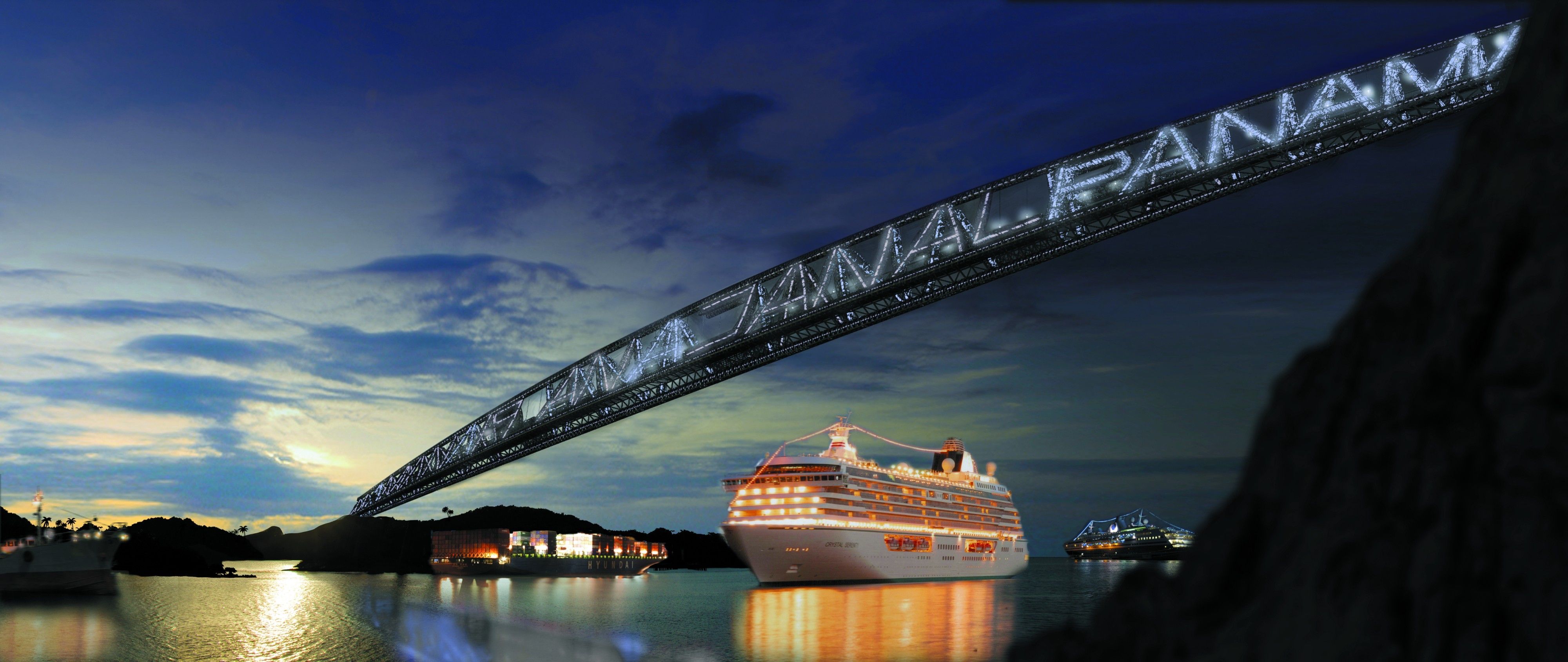 Illuminated cruise ship sailing under the iconic Panama Canal bridge at twilight, a highlight of Panama Canal cruises.