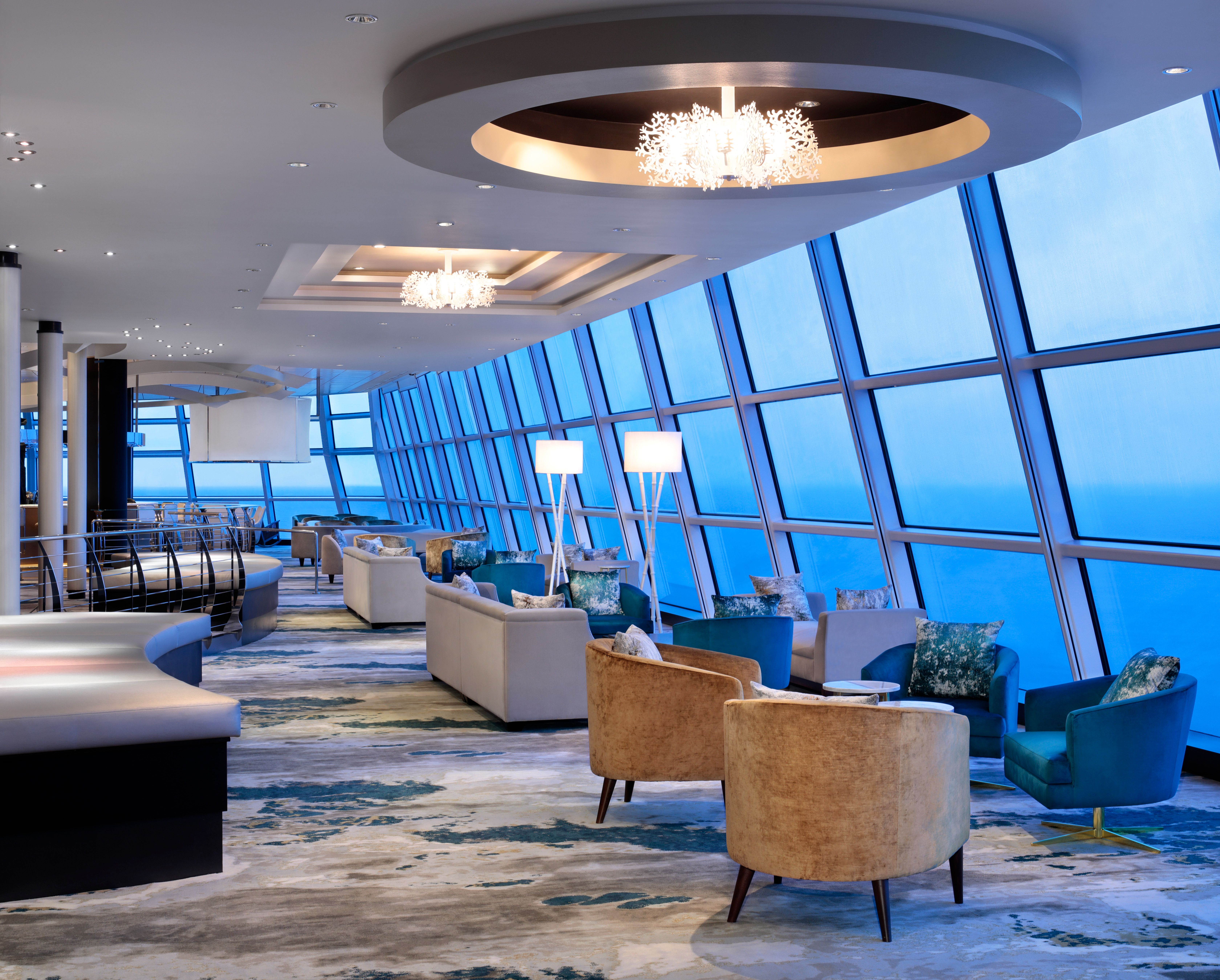 Sky Lounge on a Celebrity cruise ship with floor-to-ceiling ocean views, elegant seating, and a relaxing atmosphere.