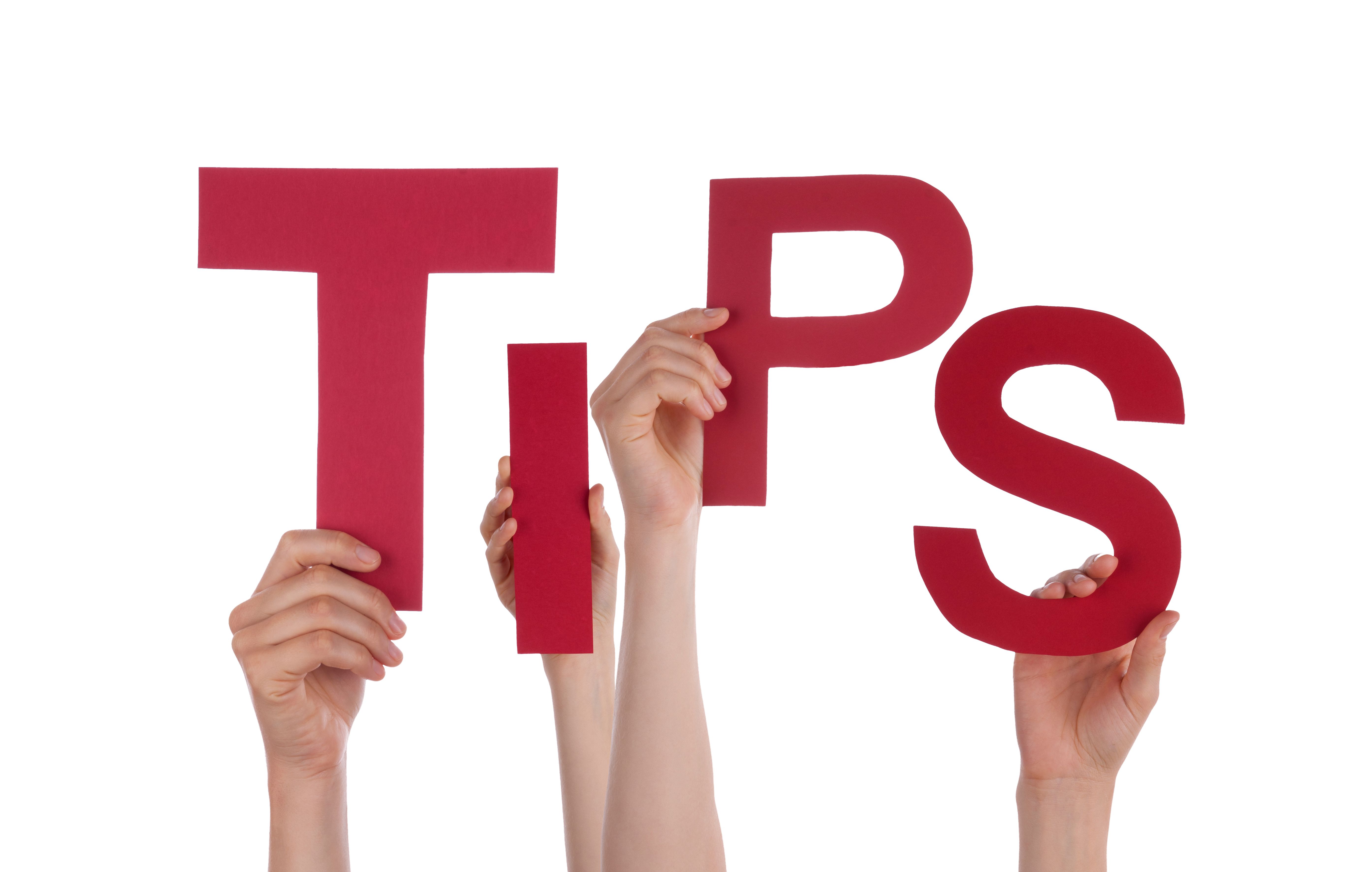 Four hands raising red cut-out letters spelling “TIPS”.