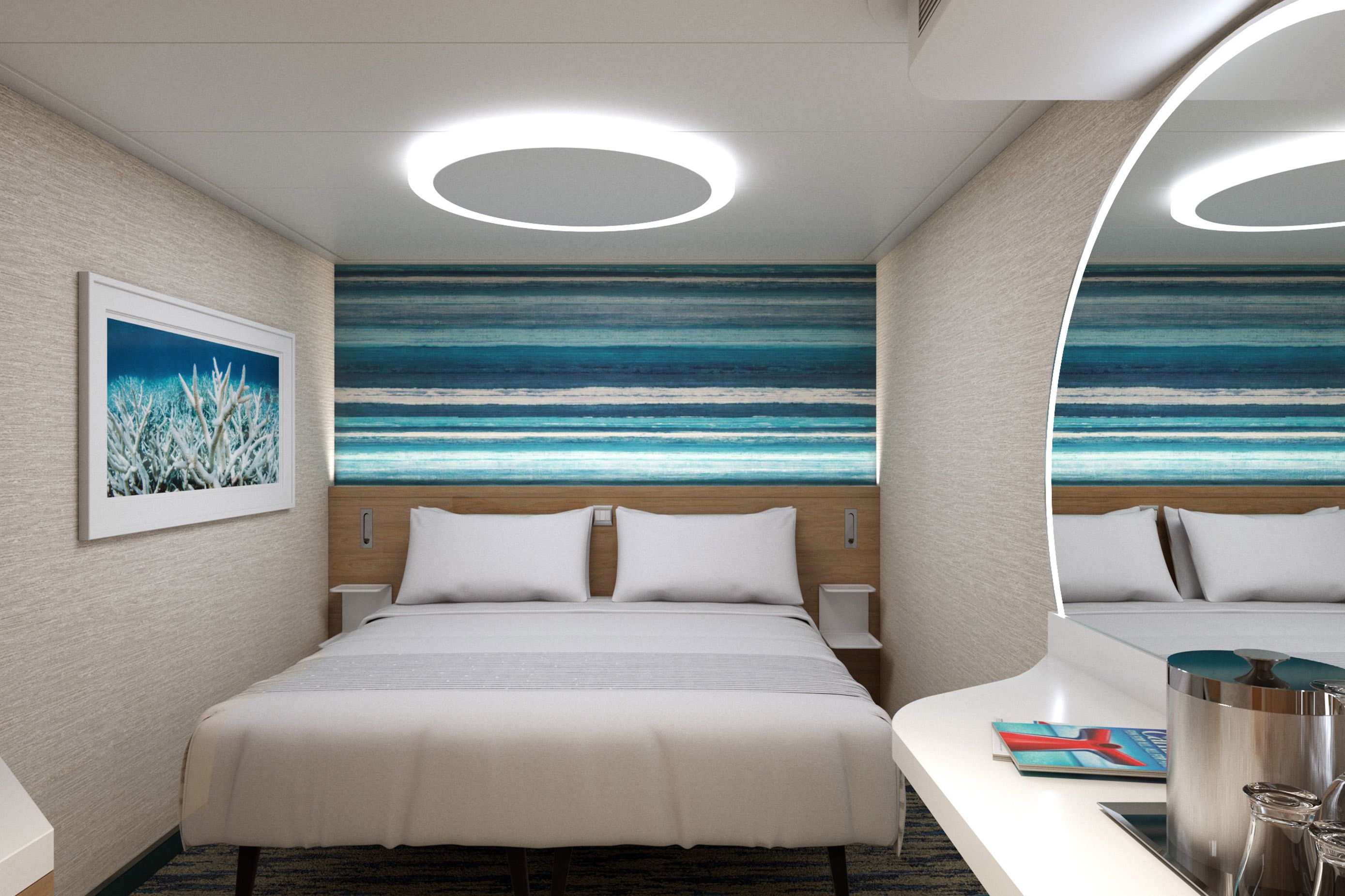 Carnival Mardi Gras 4F Interior stateroom with modern décor, twin beds convertible to a king, soft neutral tones, and ocean-inspired accent wall.