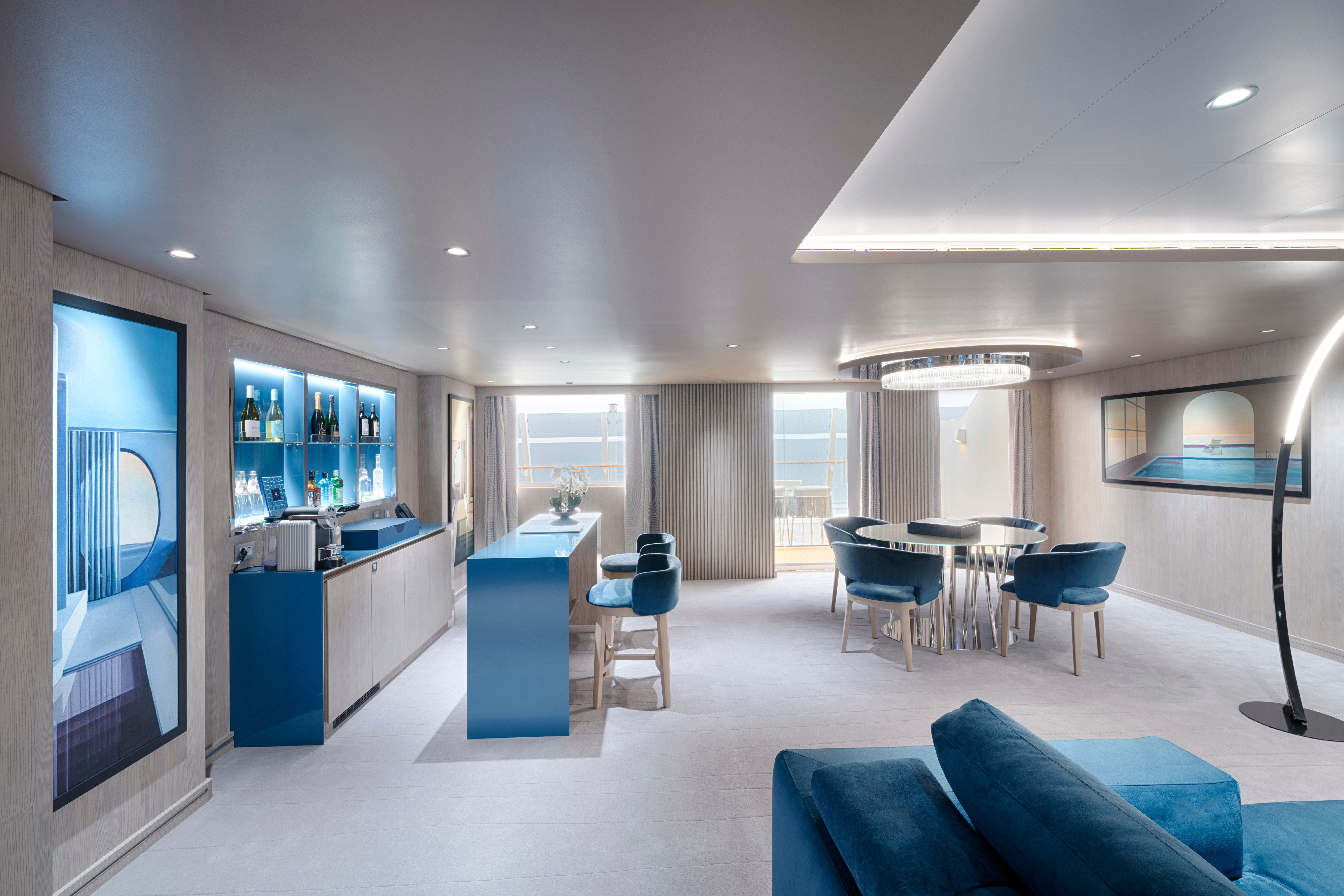 Elegant dining and bar area inside the MSC Yacht Club Owner’s Suite, offering oceanfront views, premium finishes, and exclusive comfort.
