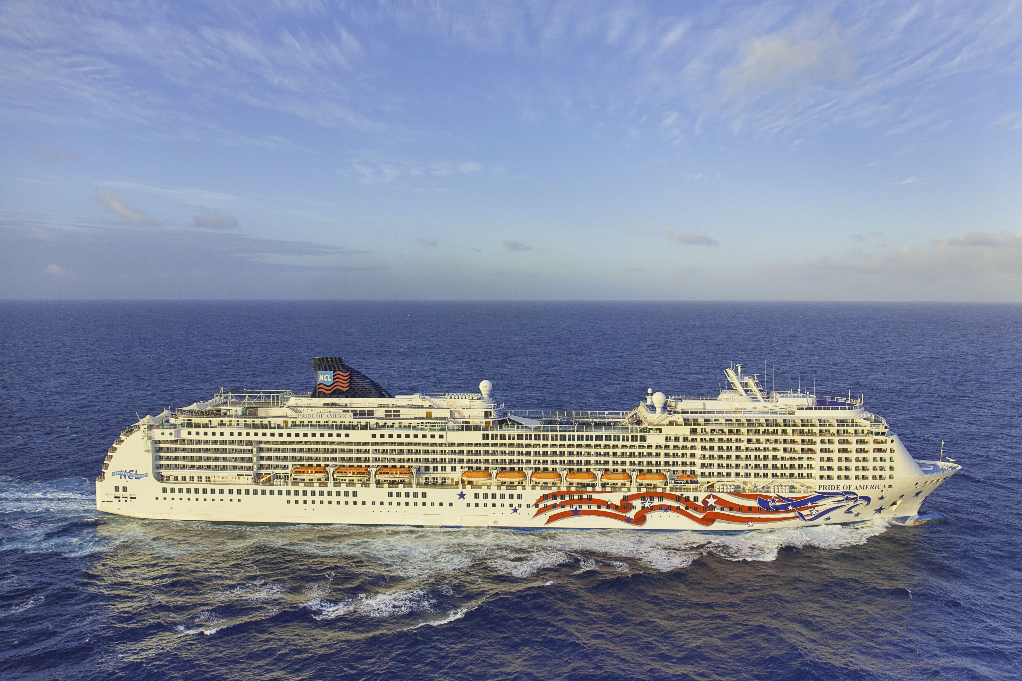 Norwegian Cruise Line Pride of America cruise ship sailing at sea, featuring its patriotic hull art on a Hawaii cruise itinerary.