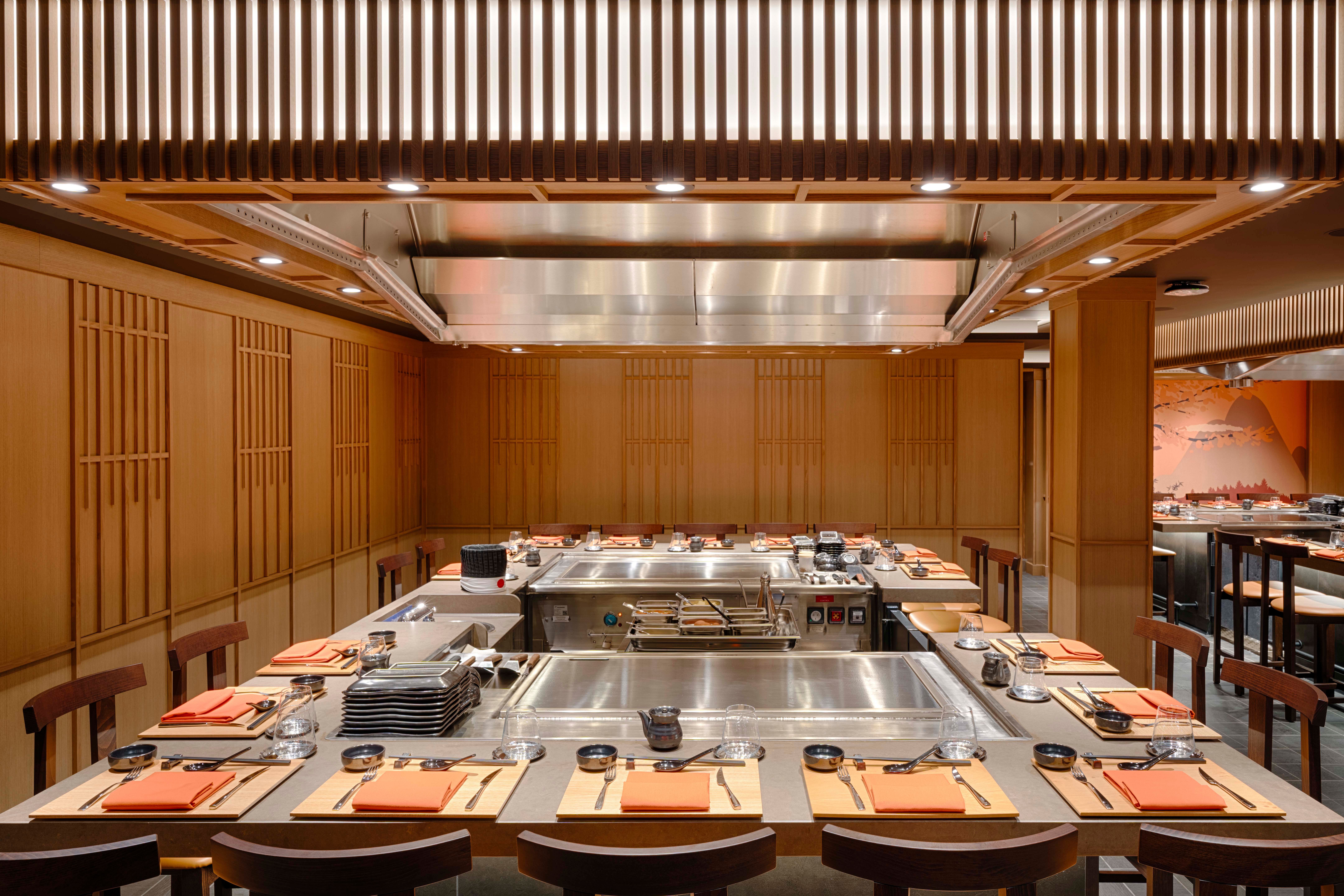 Kaito Sushi restaurant aboard MSC World America, featuring Japanese-style décor, counter seating and teppanyaki dining stations.
