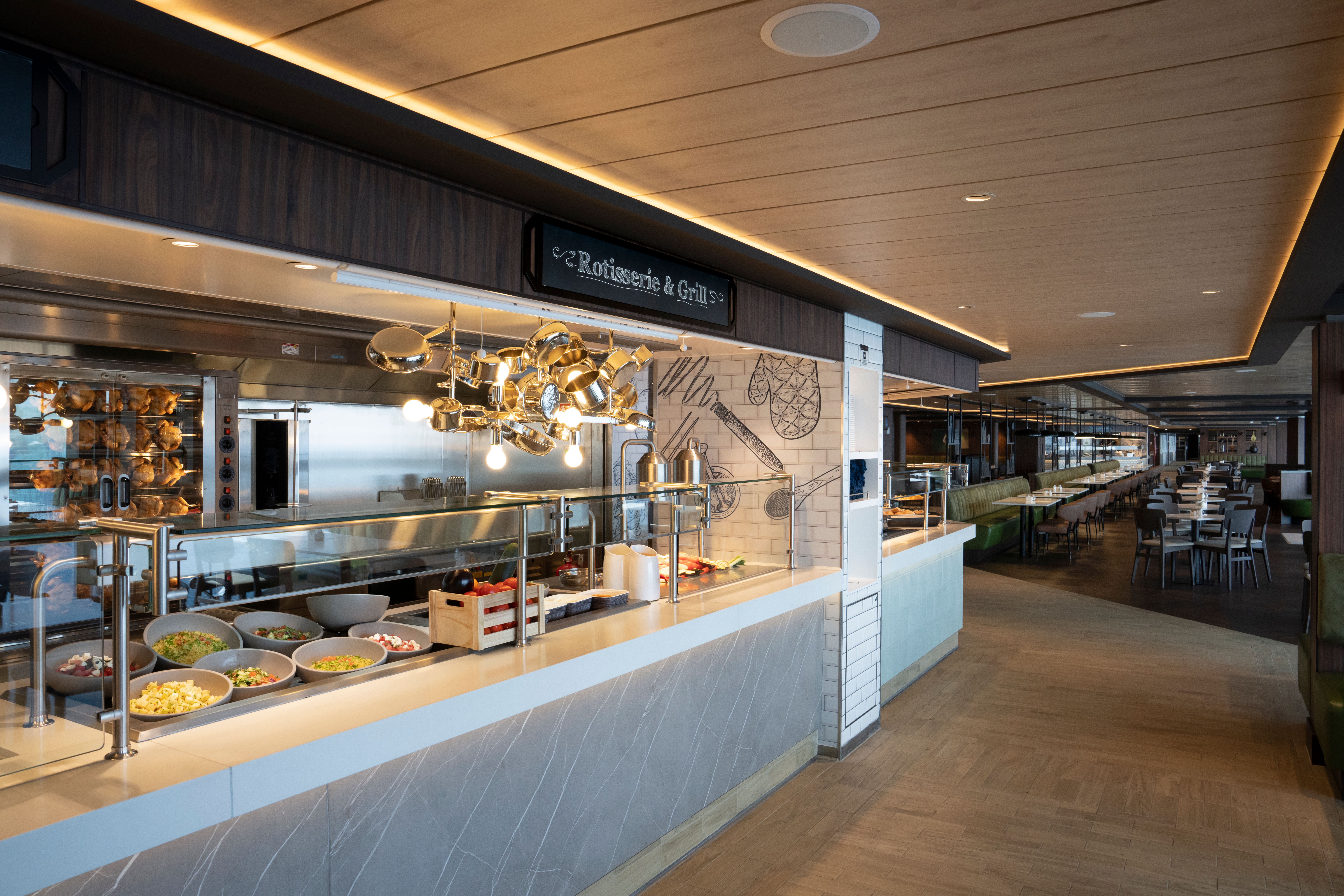 Il Mercato Buffet aboard MSC World America, featuring a Rotisserie & Grill station, fresh food displays and casual cruise ship dining.