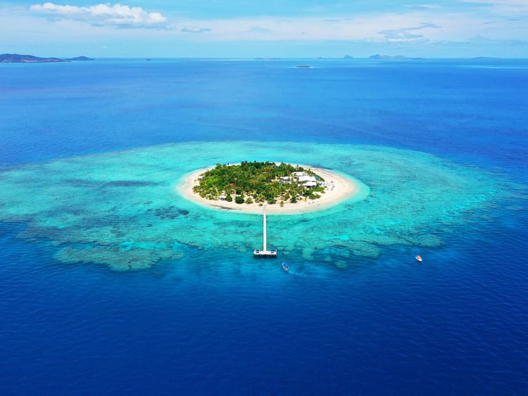 Ein idyllischer Halt f&uuml;r Ihre Kreuzfahrt: Tropeninsel im tiefblauen S&uuml;dpazifik