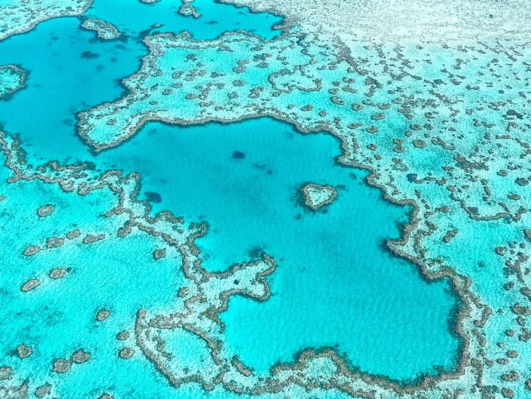 Whitsunday Islands, Queensland, Australia &ndash; Aerial view of coral reefs in turquoise waters