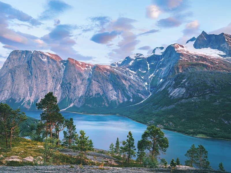 Narvik, Norway &ndash; Scenic road beneath towering mountain cliffs