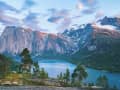 Narvik, Norway – Scenic road beneath towering mountain cliffs