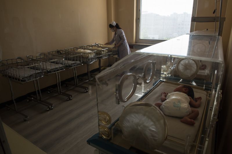 A nurse tends to new-born infants in a ward at the Pyongyang Maternity Hospital during a government-organised media tour in Pyongyang on May 7, 2016.