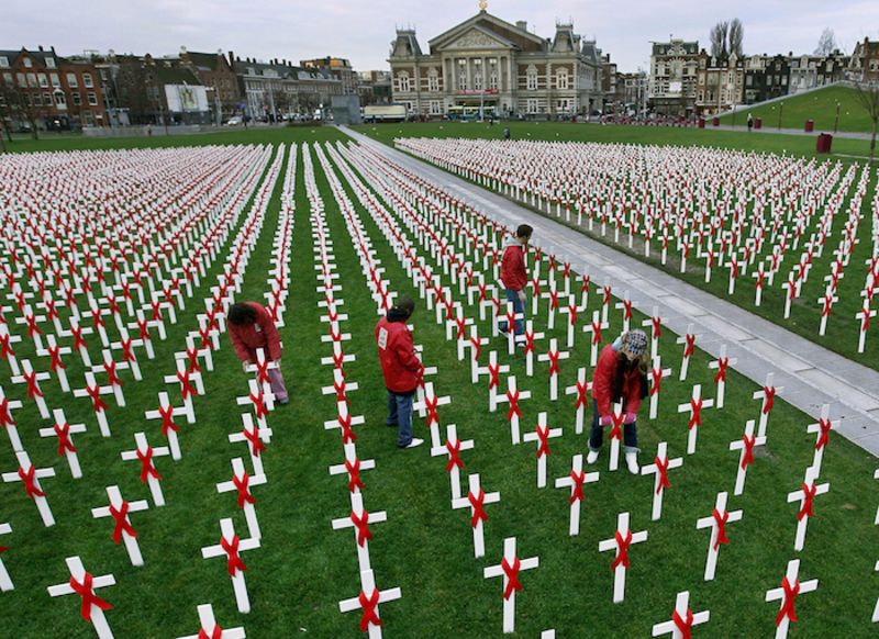 Activists place white crosses with red ribbons at the Museumplein in Amsterdam on December 1, 2009. ROBERT VOS/AFP/Getty Images