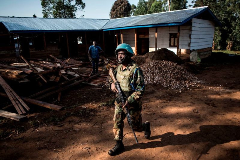 A soldier from the United Nations Organisation Stabilisation Mission in the Democratic Republic of the Congo (MONUSCO), patrols outside an Ebola Treatment Centre (ETC) in Butembo, the epicentre of DR Congo's latest Ebola outbreak, after it was attacked on March 9, 2019.