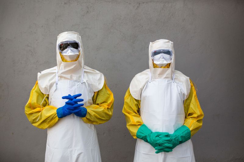 TOPSHOT - Staff from South Sudan's Health Ministry pose with protective suits during a drill for Ebola preparedness conducted by the World Health Organization (WHO) with ALIMA (The Alliance for International Medical Action) and International Medical Corps in Juba, on August 14, 2019, to contain a potential Ebola outbreak in the country.