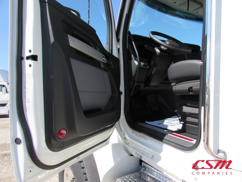 Drivers side door open for this 2024 Kenworth T880 (Stock number: RJ371262)