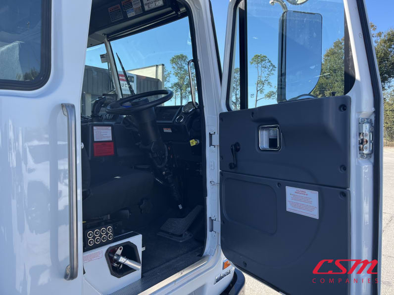 Drivers side door open for this 2026 Autocar ACX Xpeditor (Stock number: TC252260)