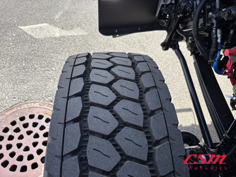 Driver side front tire tread for this 2026 Kenworth T880 (Stock number: TJ224818)