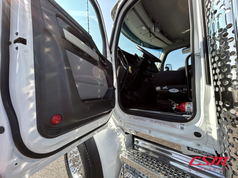Drivers side door open for this 2026 Kenworth T880 (Stock number: TJ224826)