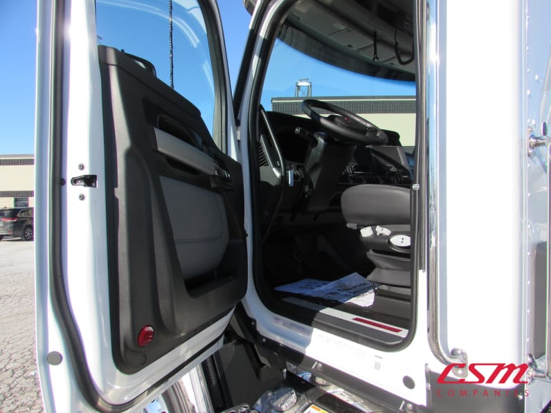 Drivers side door open for this 2026 Kenworth T680 Short Hood (Stock number: TJ230322)