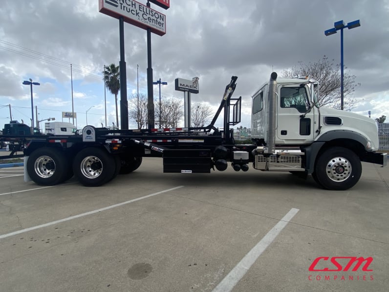 Exterior full passenger side for this 2026 Mack Granite GR64 (Stock number: TM051792)Weeee
