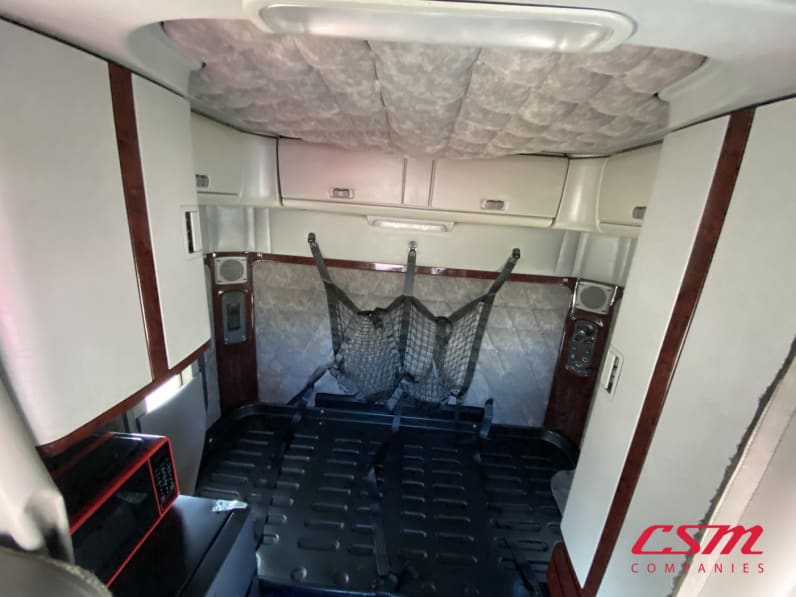 Interior wide sleeper view for this 2021 Freightliner 122SD SFA (Stock number: UMDMY4366)Weeee