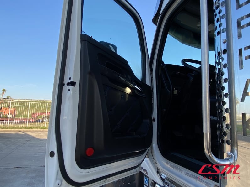 Drivers side door open for this 2023 Kenworth W990 (Stock number: UPJ220963)