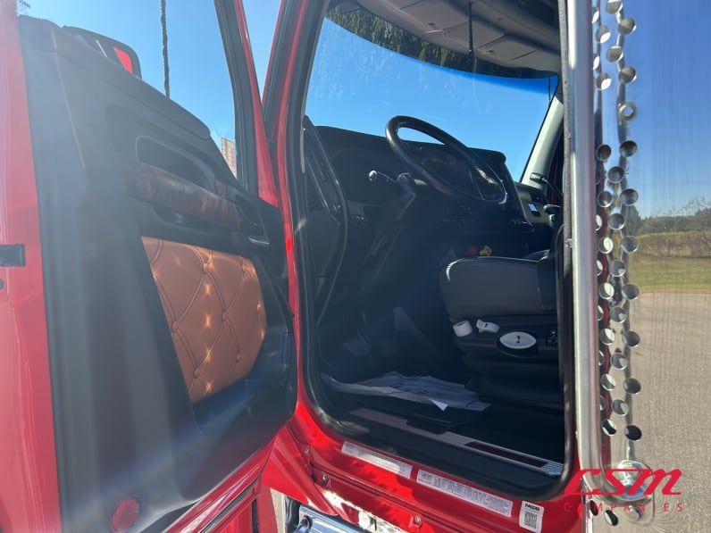 Drivers side door open for this 2023 Kenworth W990 (Stock number: UPJ240230)