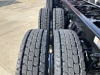 Driver side rear frame and tire tread for this 2025 Kenworth T880 Short Hood (Stock number: SJ154923)