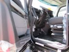 Drivers side door open for this 2025 Kenworth T880 Short Hood (Stock number: SJ173928)
