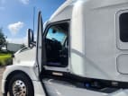 Drivers side door open for this 2026 Kenworth T680 (Stock number: TJ219908)