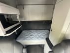 Interior wide sleeper view for this 2026 Kenworth T680 (Stock number: TJ219913)