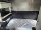 Interior wide sleeper view for this 2026 Kenworth T680 (Stock number: TJ219915)