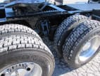 Passenger side rear frame and tire tread for this 2026 Kenworth T680 Short Hood (Stock number: TJ230322)