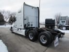 Exterior rear driver side for this 2021 Kenworth T680 (Stock number: UMJ434940A)