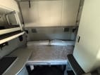 Interior wide sleeper view for this 2022 Kenworth T680 (Stock number: UNJ467048)