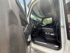 Drivers side door open for this 2023 Kenworth W990 (Stock number: UPJ220959)