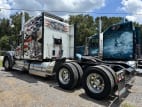Exterior rear driver side for this 2023 Kenworth W990 (Stock number: UPJ220959)