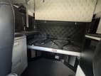 Interior wide sleeper view for this 2023 Kenworth W990 (Stock number: UPJ220959)