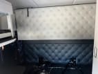 Interior wide sleeper view for this 2023 Kenworth W990 (Stock number: UPJ220962)