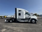 Exterior full passenger side for this 2023 Kenworth T680 (Stock number: UPJ231782)
