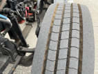 Driver side front tire tread for this 2023 Kenworth W900L (Stock number: UPR256936)