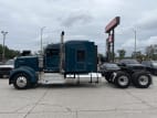 Exterior full driver side for this 2023 Kenworth W900L (Stock number: UPR256936)