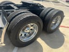 Passenger side rear frame and tire tread for this 2025 Kenworth T880 Short Hood (Stock number: SJ131745)