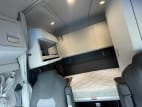 Interior wide sleeper view for this 2025 Kenworth T680 (Stock number: SJ381389)