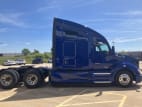 Exterior full passenger side for this 2021 Kenworth T680 (Stock number: UMJ434843)