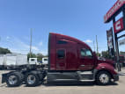 Exterior full passenger side for this 2021 Kenworth T680 Short Hood (Stock number: UMJ436568)