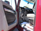 Drivers side door open for this 2021 Kenworth T680 Short Hood (Stock number: UMJ436595)